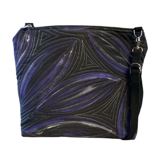 A unique art bag with a hand-painted leaf pattern and free motion quilting